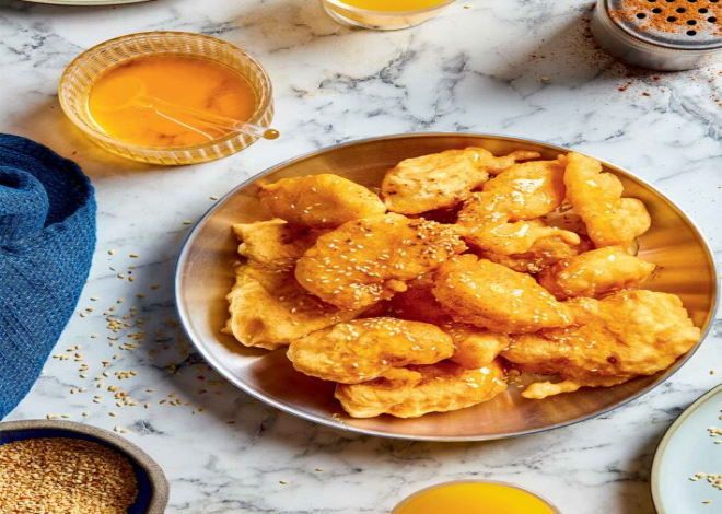 Η συνταγή της ημέρας: ''Αφράτες τηγανίτες της Μήλου με μέλι κανέλα και σουσάμι''